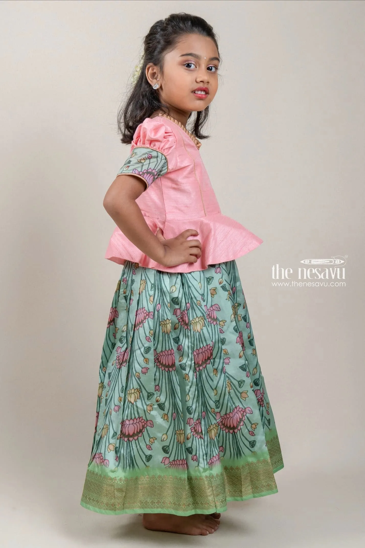Premium Green Silk Pattu Pavadai with Salmon Pink Floral Cuffs and Banarasi Border for Girls